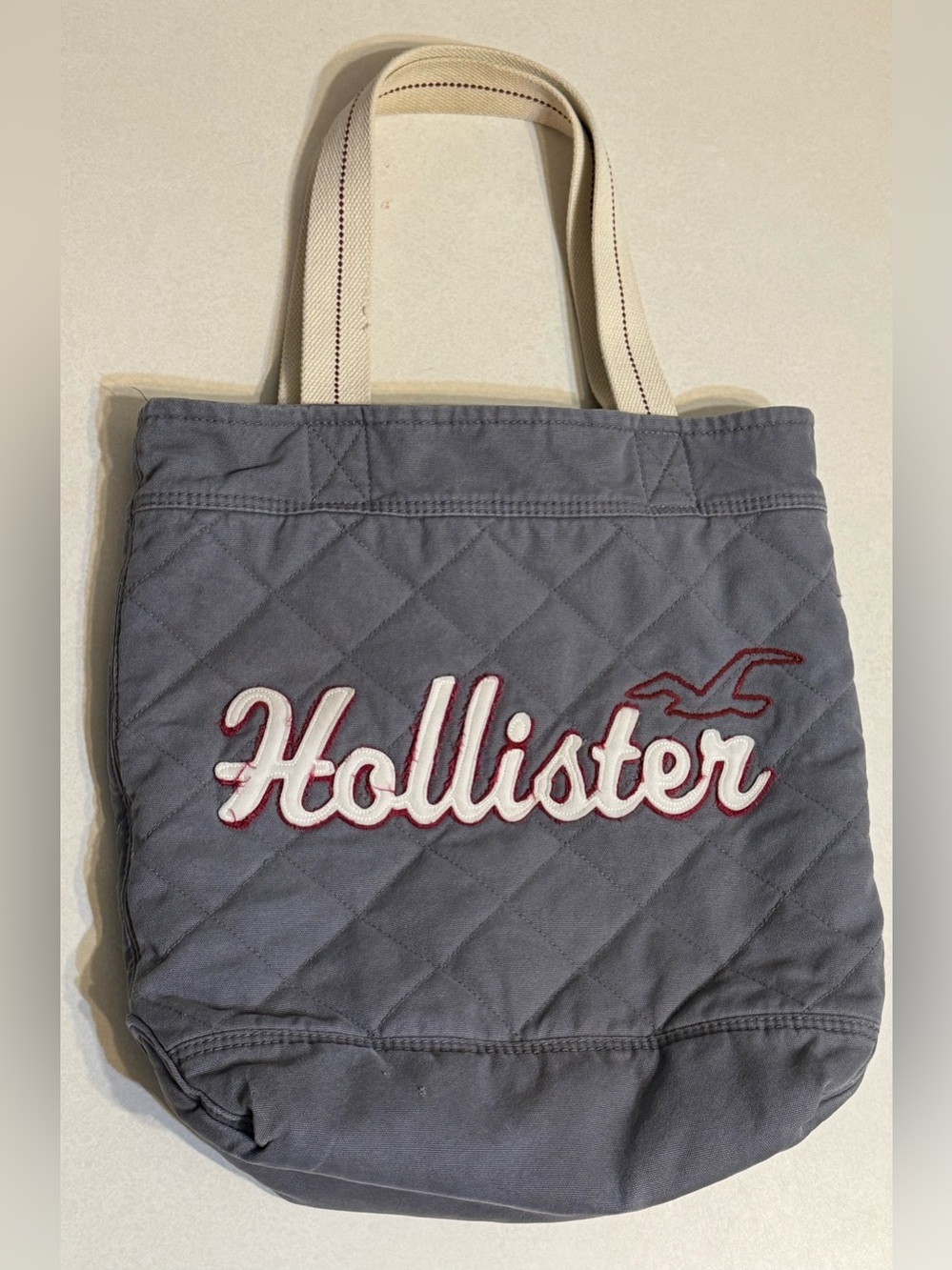 Hollister Gray Quilted Tote with Cream Handles and Red Trim